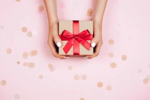 Hands holding present box Stock Photos