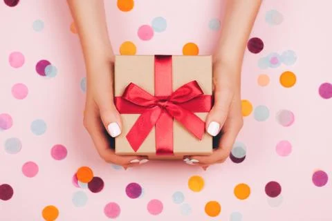 Hands holding present box Stock Photos