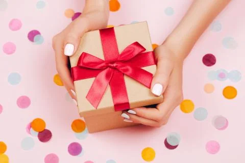 Hands holding present box Stock Photos
