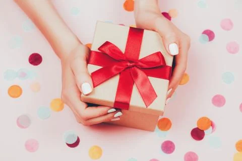 Hands holding present box Stock Photos