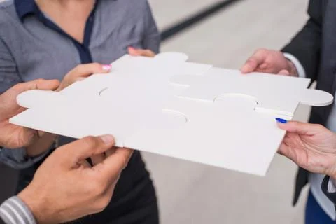 Hands holding puzzle Stock Photos
