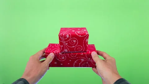 Hands holding red gift boxes isolated on green screen chromakey background 스톡 동영상 86922695
