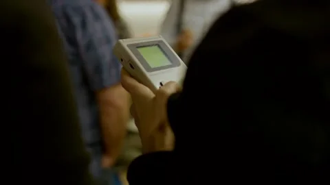 Hands Holding Retro Handheld Console, Green Screen Close Up Shot 動画素材 342281642