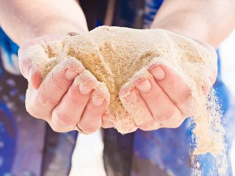 Hands holding sand Stock Photos