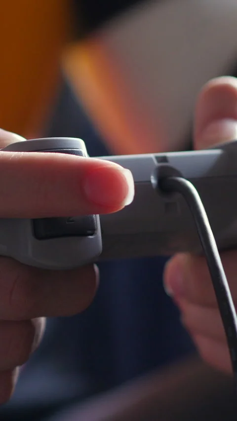 Hands Holding Side View Of Game Controller. Slider Shot. Vertical. Stock Footage 306188622