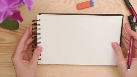 Hands Holding sketchbook Video stock 147140883