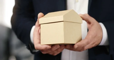 Hands holding a small House to the Camera Stock Footage 82184280