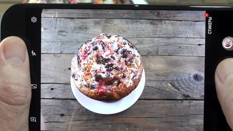 Hands holding smartphone and Easter cake Stock Footage 146679978