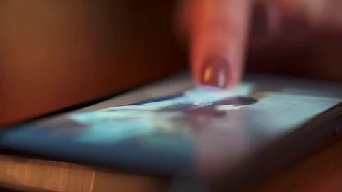 Hands holding smartphone with glowing screen Stock Footage 73868388