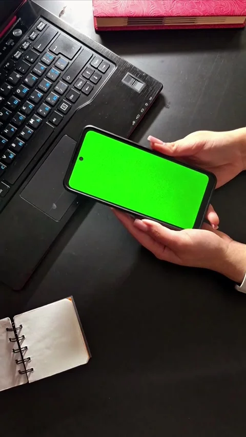 Hands Holding Smartphone with Green Screen Video stock 307844982