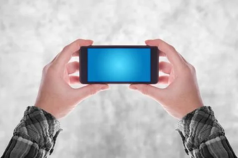 Hands holding smartphone Stock Photos