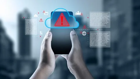 Hands holding a smartphone showing a cloud storage security warning and cyb.. Foto stock