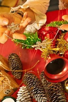 Hands holding snowflake string decorating for christmas Stock Photos