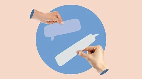 Hands holding speech bubbles symbolizing message exchange during communication Stock Photos
