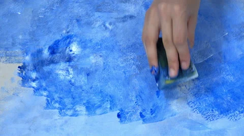 Hands holding a sponge and paint over the wall. Artist tool. Video stock 66529437