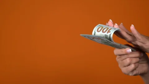 Hands holding stack of money counting 100 dollars banknotes Stock Footage 120795854