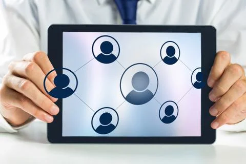 Hands holding tablet computer with vignettes Stock Photos