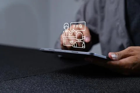 Hands Holding Tablet with FAQ Icon for Customer Support Concept Stock Photos
