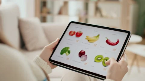 Hands holding tablet pc and scrolling web site of grocery store. Use online payi Stock Footage 199484708