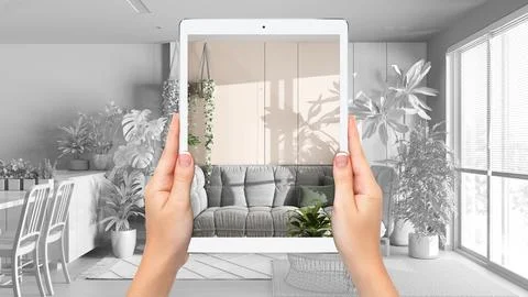Hands holding tablet showing dining and living room, total blank project ba.. Stock Illustration