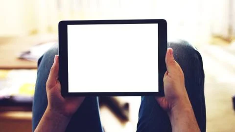 Hands holding Tablet with white screen. Stock Photos
