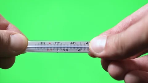 Hands holding thermometer on green screen background 스톡 동영상 129465489