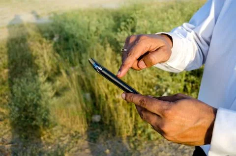 Hands holding touchscreen mobile device Stock Photos