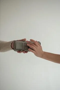Hands holding triple socket and switch Stock Photos