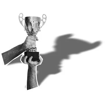 Hands holding a trophy above head with a shadow on a white background. Stock Photos
