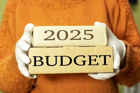 Hands holding two boxes with 2025 budget concept Stock Photos