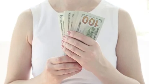 Hands holding US dollars.  Stock Footage 76894720