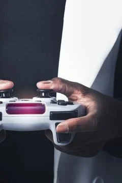Hands holding video game controller Stock Photos