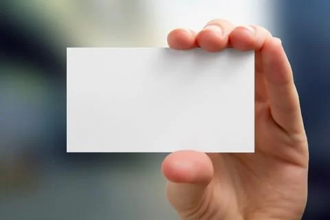 Hands holding a white business visit card, gift, ticket, pass, p Stock-Fotos