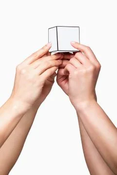 Hands holding white cube Stock Photos