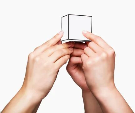 Hands holding white cube Stock Photos