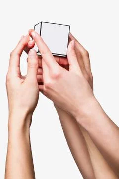 Hands holding white cube Stock Photos
