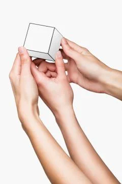 Hands holding white cube Stock-Fotos