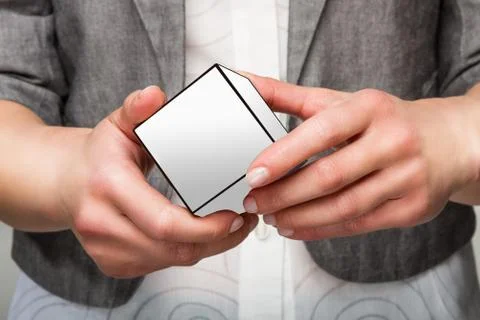 Hands holding white cube Stock-Fotos