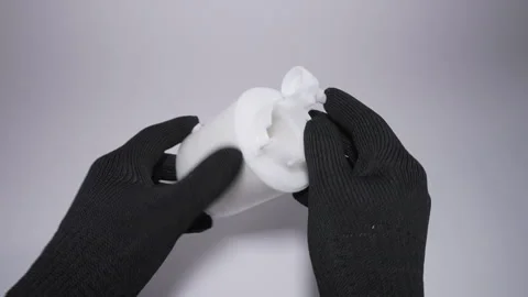 Hands Holding a White Cylindrical Object in a Professional Context 库存影片 303826654