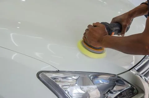 Hands holding the work tool polish car. Stock Photos