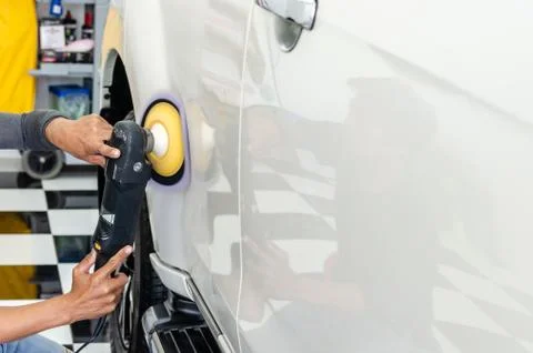 Hands holding the work tool polish car. Stock Photos
