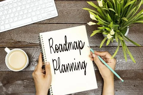 Hands holding writing Roadmap Planning Text , desktop Stock Photos