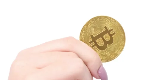 Hands holds and shows two golden cryptocurrency bitcoin on white background Stock Footage 249951278