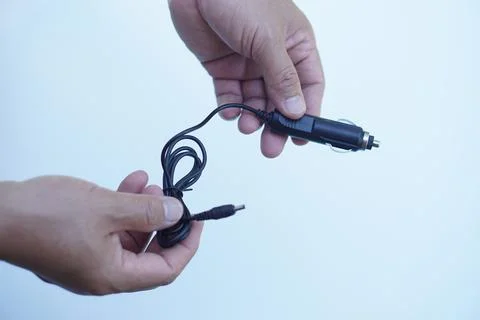 Hands holds device for digital camera battery charger kit Stock Photos