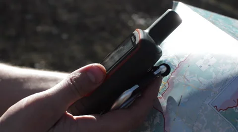 In Hands Holds a Navigator and Map Stock Footage 62416366