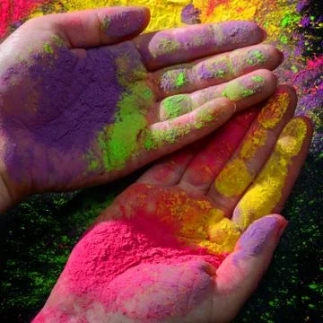 Hands with holi paint Stock Photos