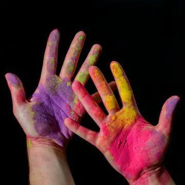 Hands with holi paint Stock Photos