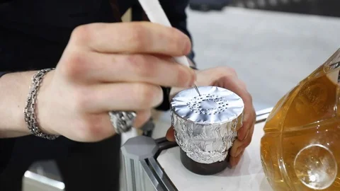 Hands Of Hookah Server Makes Holes In The Foil Covering The Ceramic Bowl With To Stock-Footage 104748277