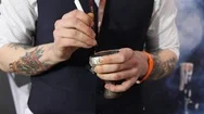 Hands Of Hookah Waiter Make Holes In The Foil Covering The Ceramic Bowl With To Stock Footage