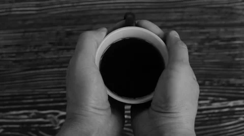 In the hands of a hot cup of black tea Stock Footage 63187824